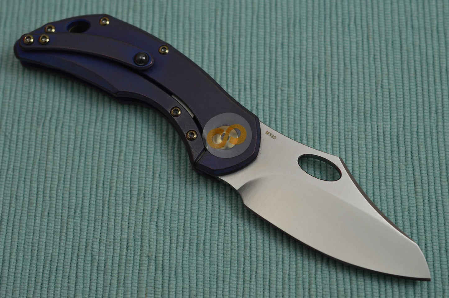Olamic Cutlery BUSKER, Semper M390 Blade, Titanium Kinetic Ocean Frame (SOLD)