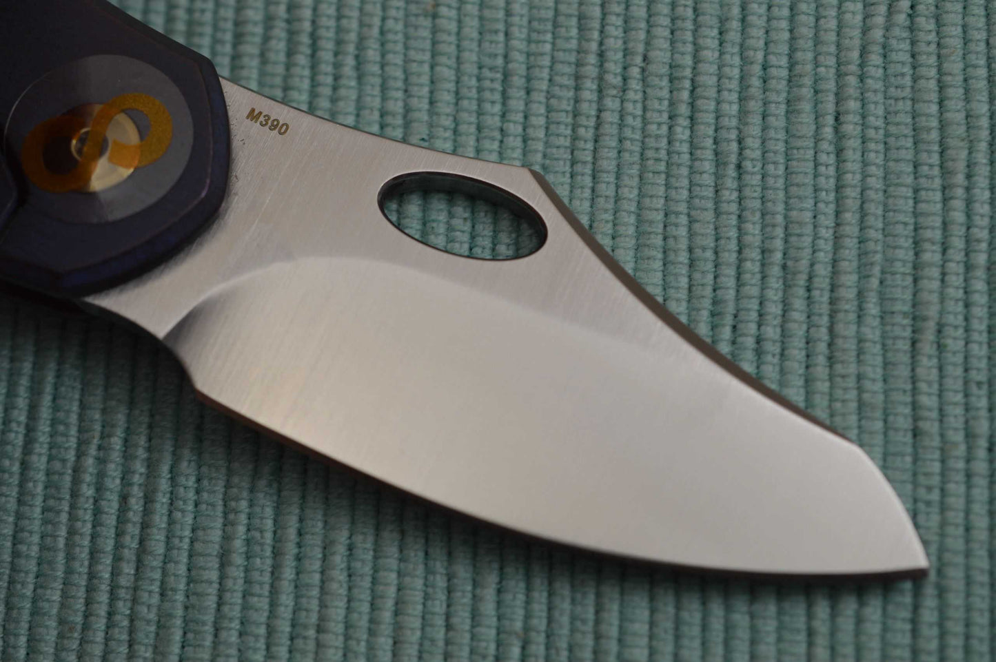 Olamic Cutlery BUSKER, Semper M390 Blade, Titanium Kinetic Ocean Frame (SOLD)