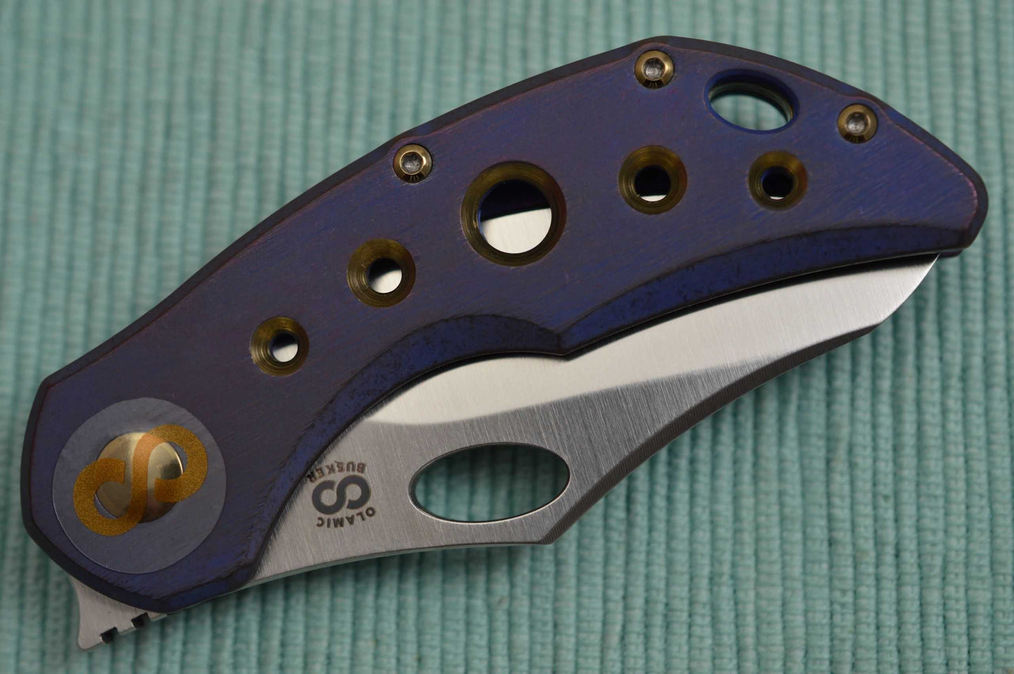 Olamic Cutlery BUSKER, Semper M390 Blade, Titanium Kinetic Ocean Frame (SOLD)