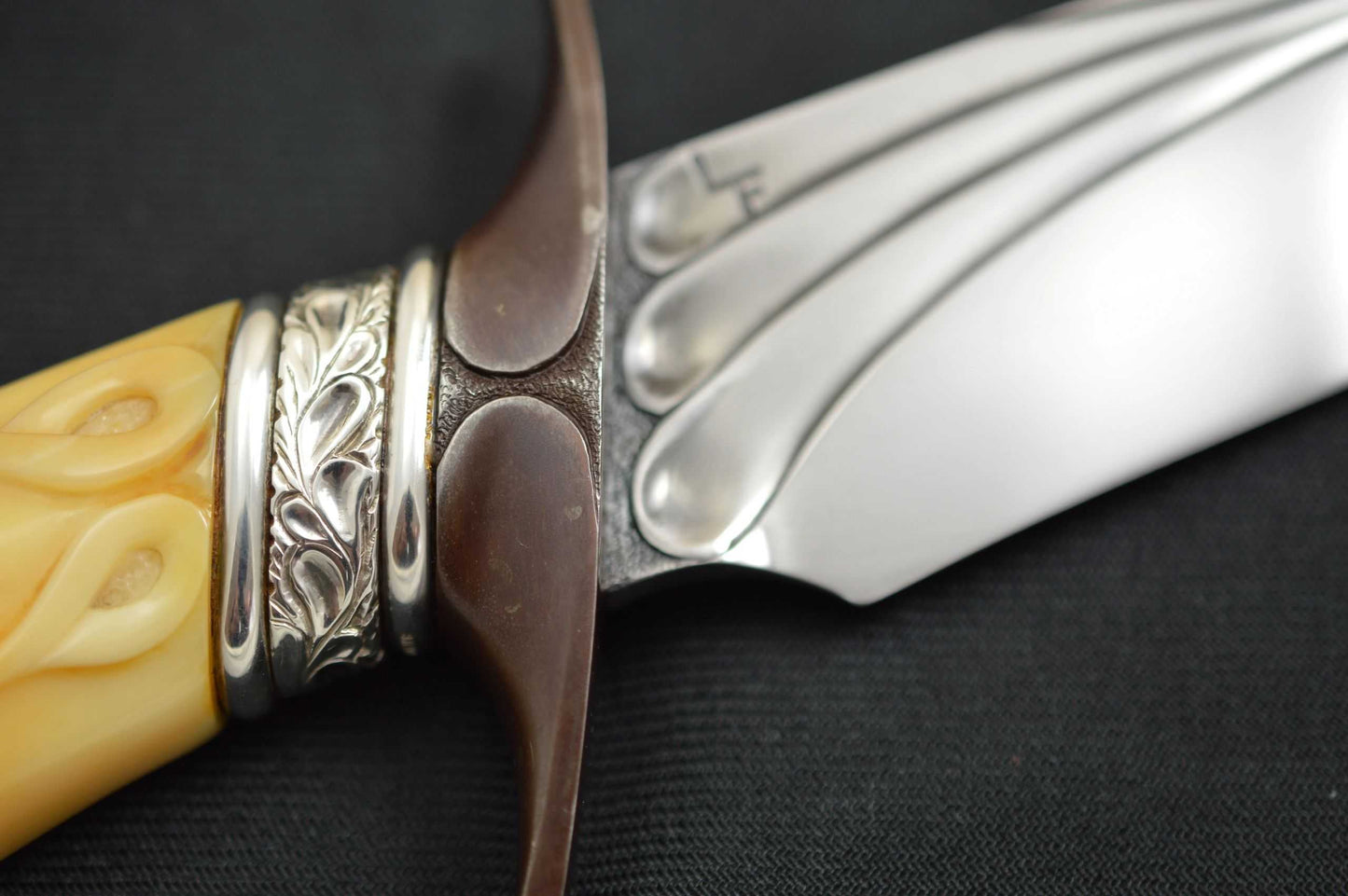 Larry Fuegen, M.S. Fighter, Carved Fossilized Material Handle, Sterling Silver Collar (SOLD)