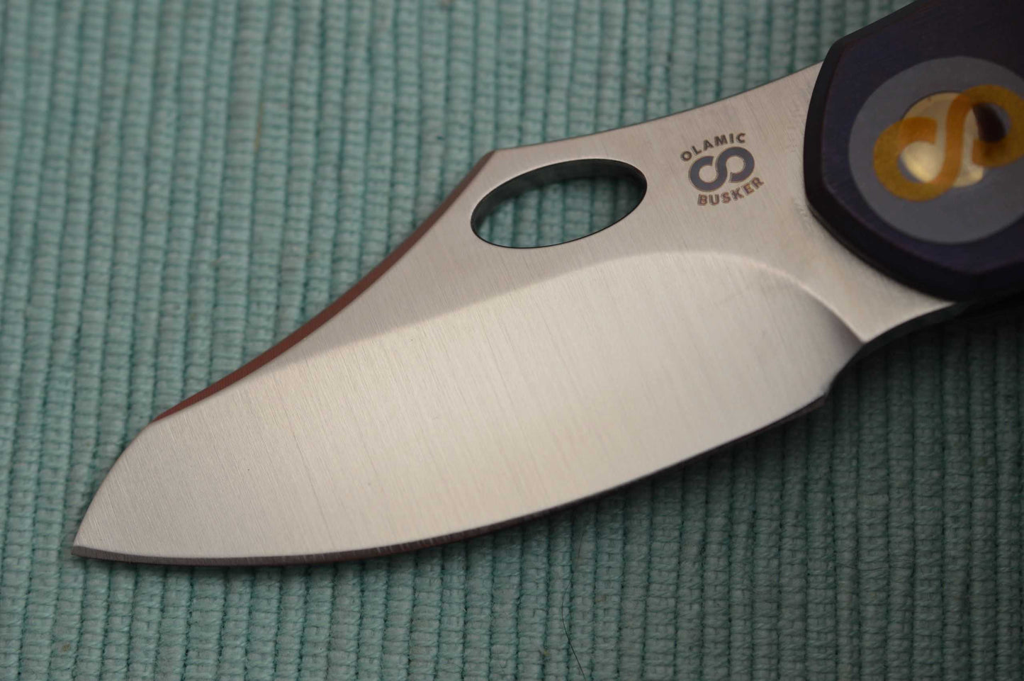 Olamic Cutlery BUSKER, Semper M390 Blade, Titanium Kinetic Ocean Frame (SOLD)