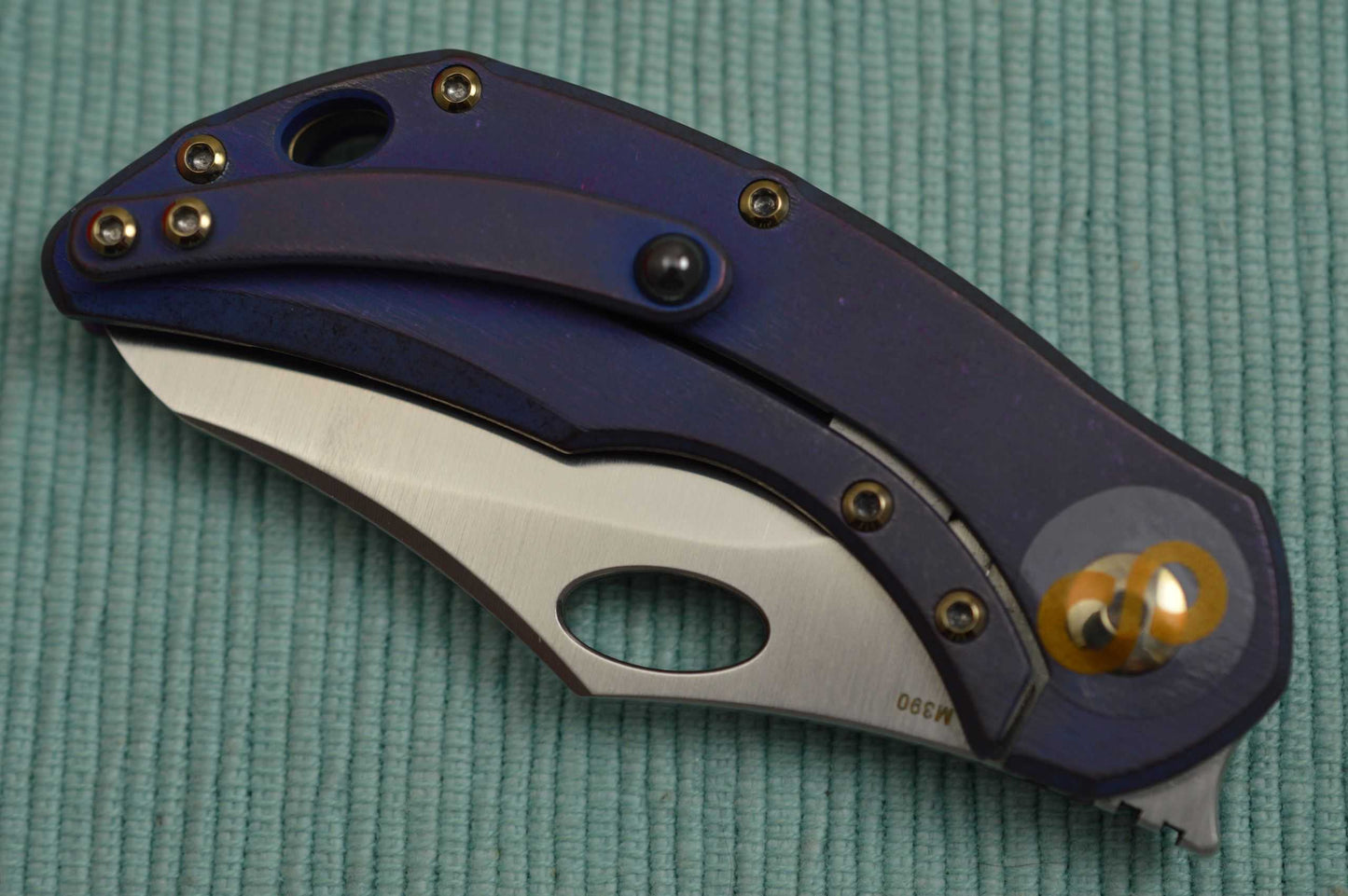 Olamic Cutlery BUSKER, Semper M390 Blade, Titanium Kinetic Ocean Frame (SOLD)