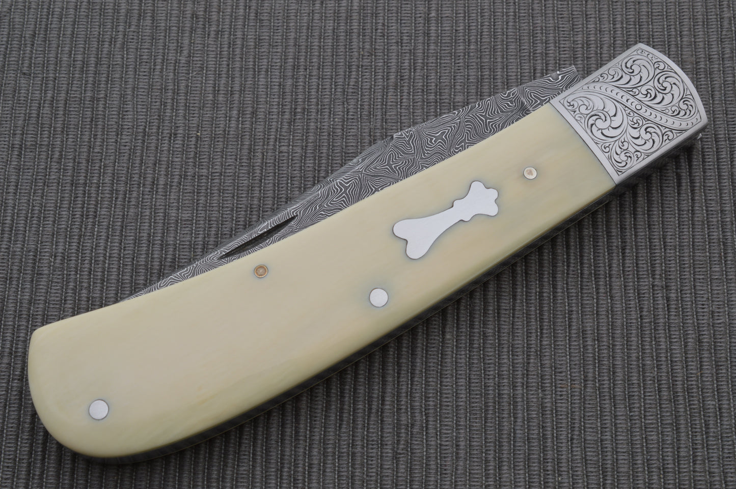 Steve Dunn M.S. Damascus Engraved Goat Horn Trapper, Slip-Joint Folding Knife