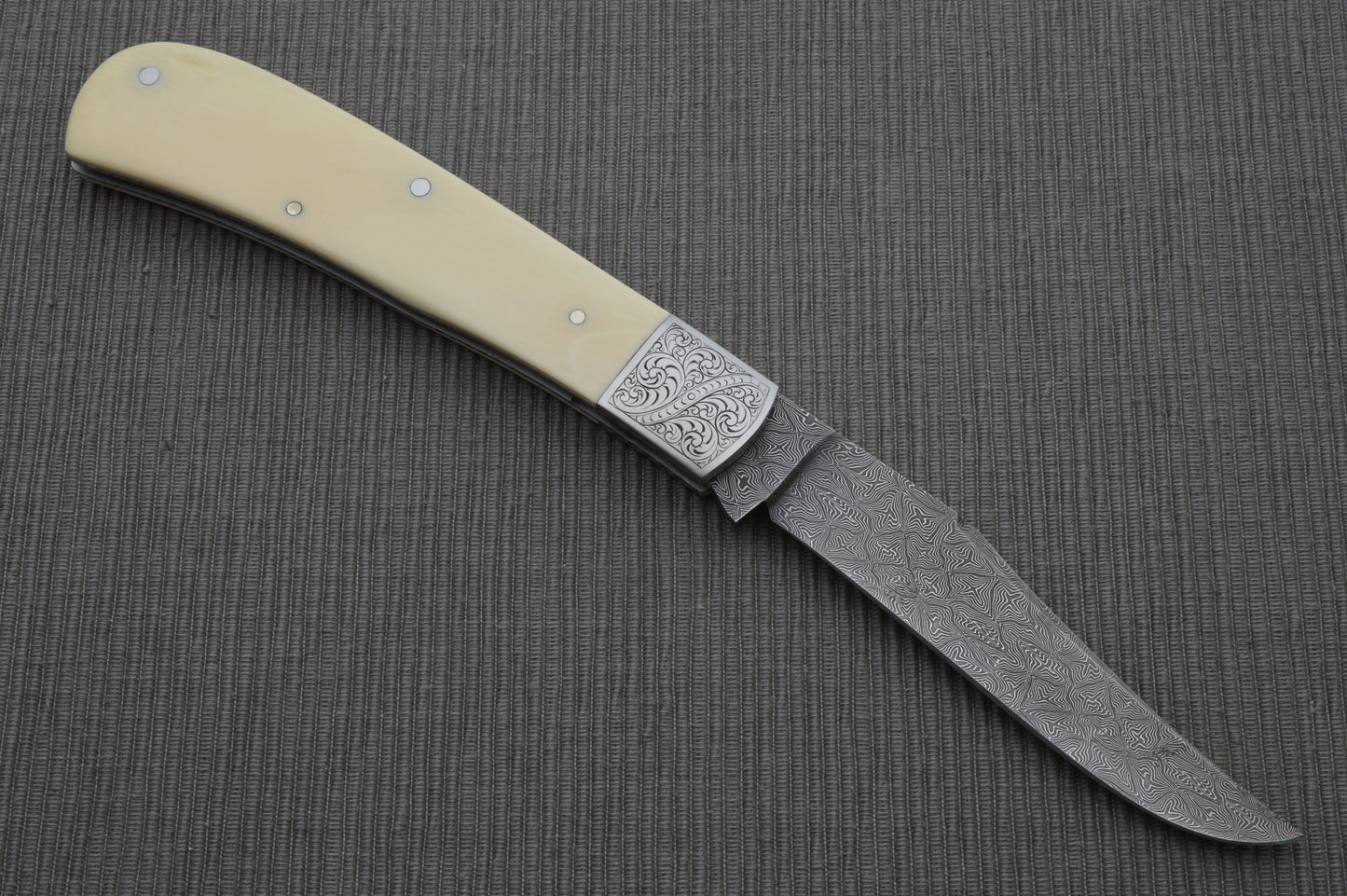 Steve Dunn M.S. Damascus Engraved Goat Horn Trapper, Slip-Joint Folding Knife