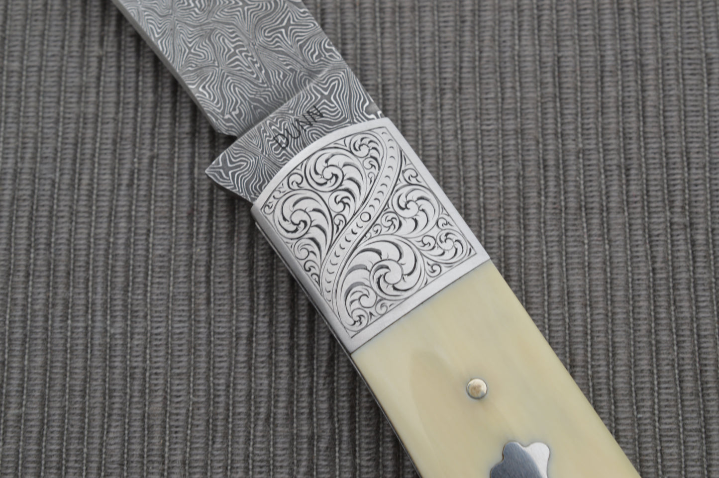 Steve Dunn M.S. Damascus Engraved Goat Horn Trapper, Slip-Joint Folding Knife