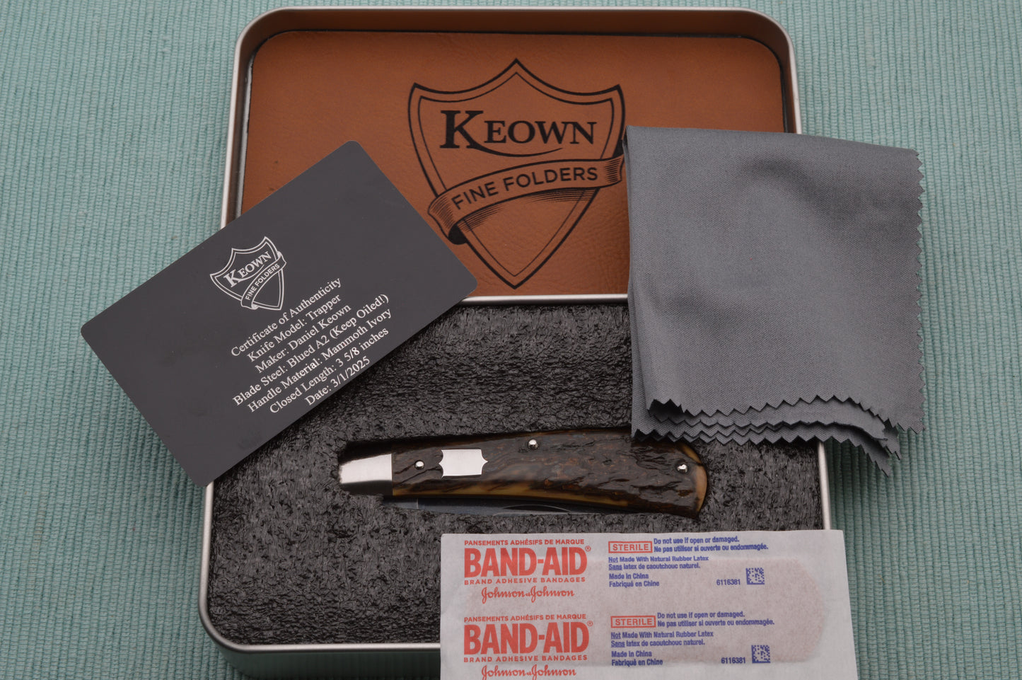 Daniel Keown Blued A2 Trapper, Ancient Fossil Material Slip-Joint Folding Knife (SOLD)
