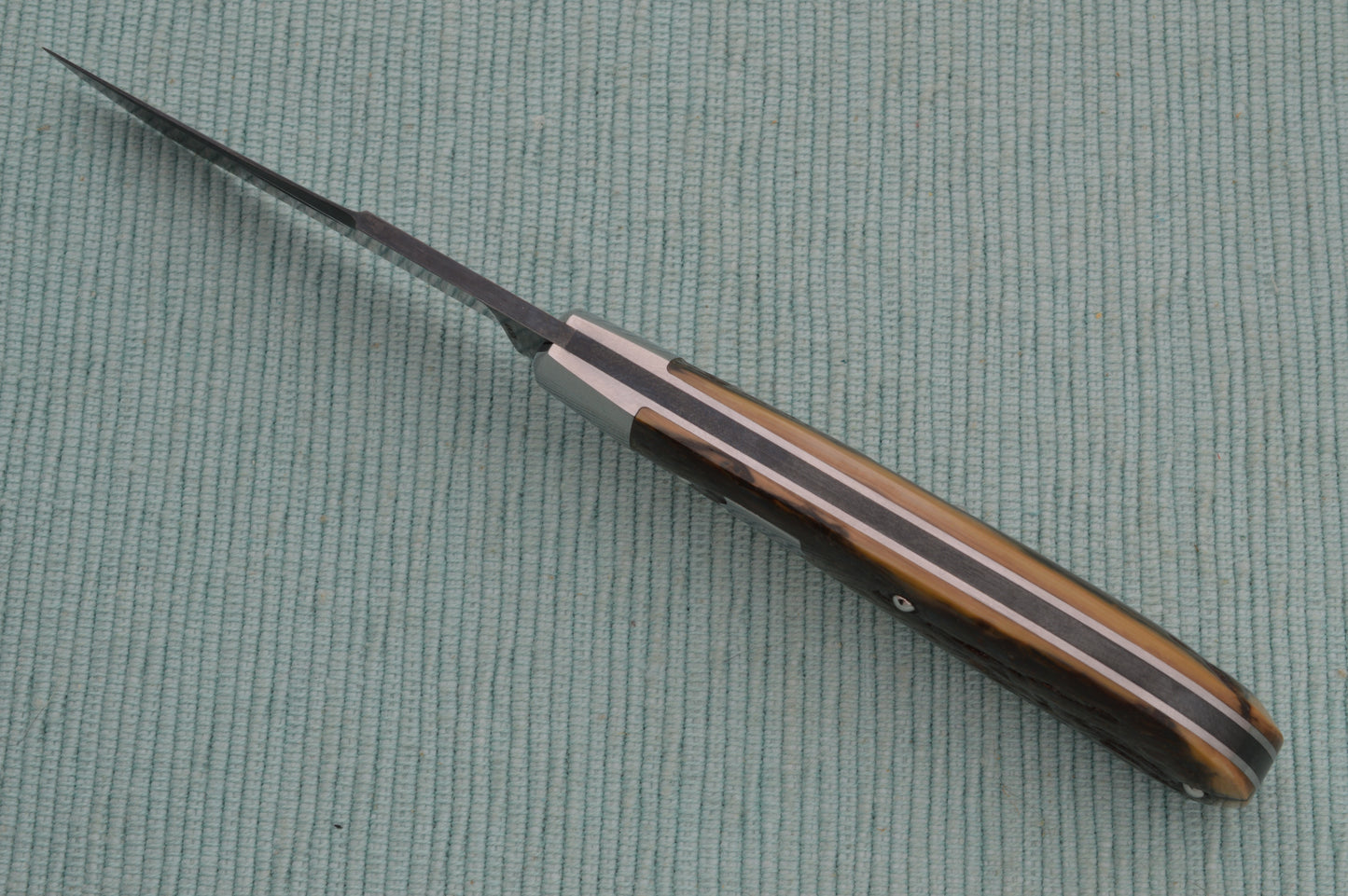 Daniel Keown Blued A2 Trapper, Ancient Fossil Material Slip-Joint Folding Knife (SOLD)