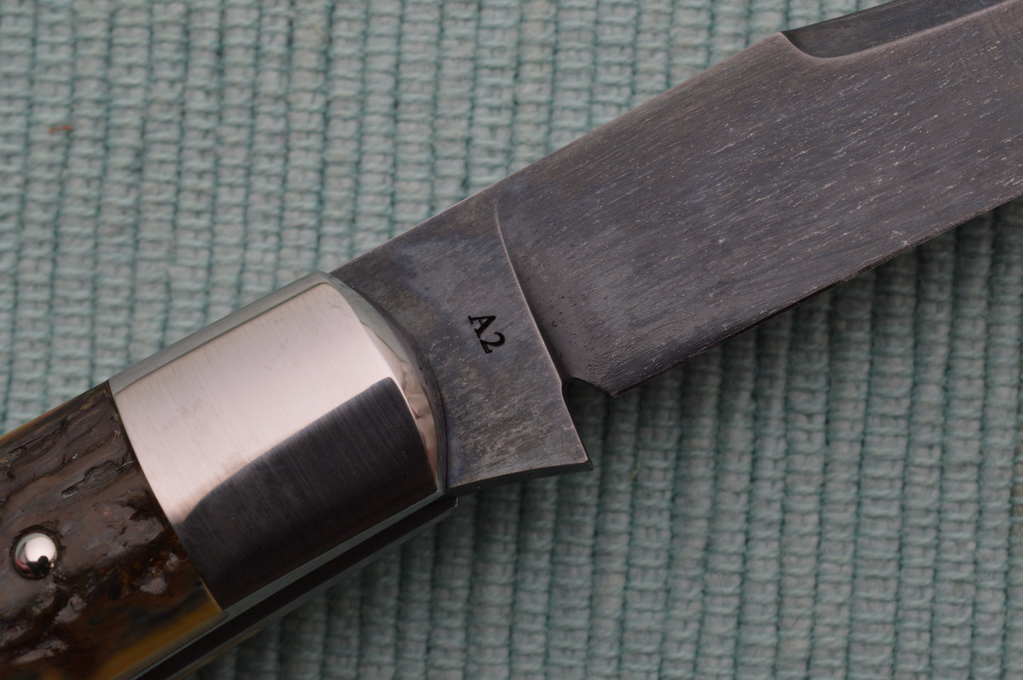 Daniel Keown Blued A2 Trapper, Ancient Fossil Material Slip-Joint Folding Knife (SOLD)