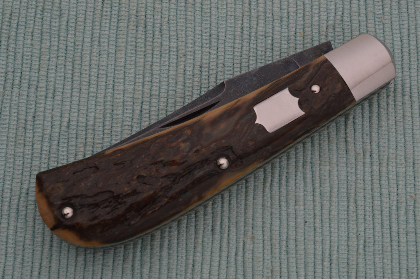 Daniel Keown Blued A2 Trapper, Ancient Fossil Material Slip-Joint Folding Knife (SOLD)