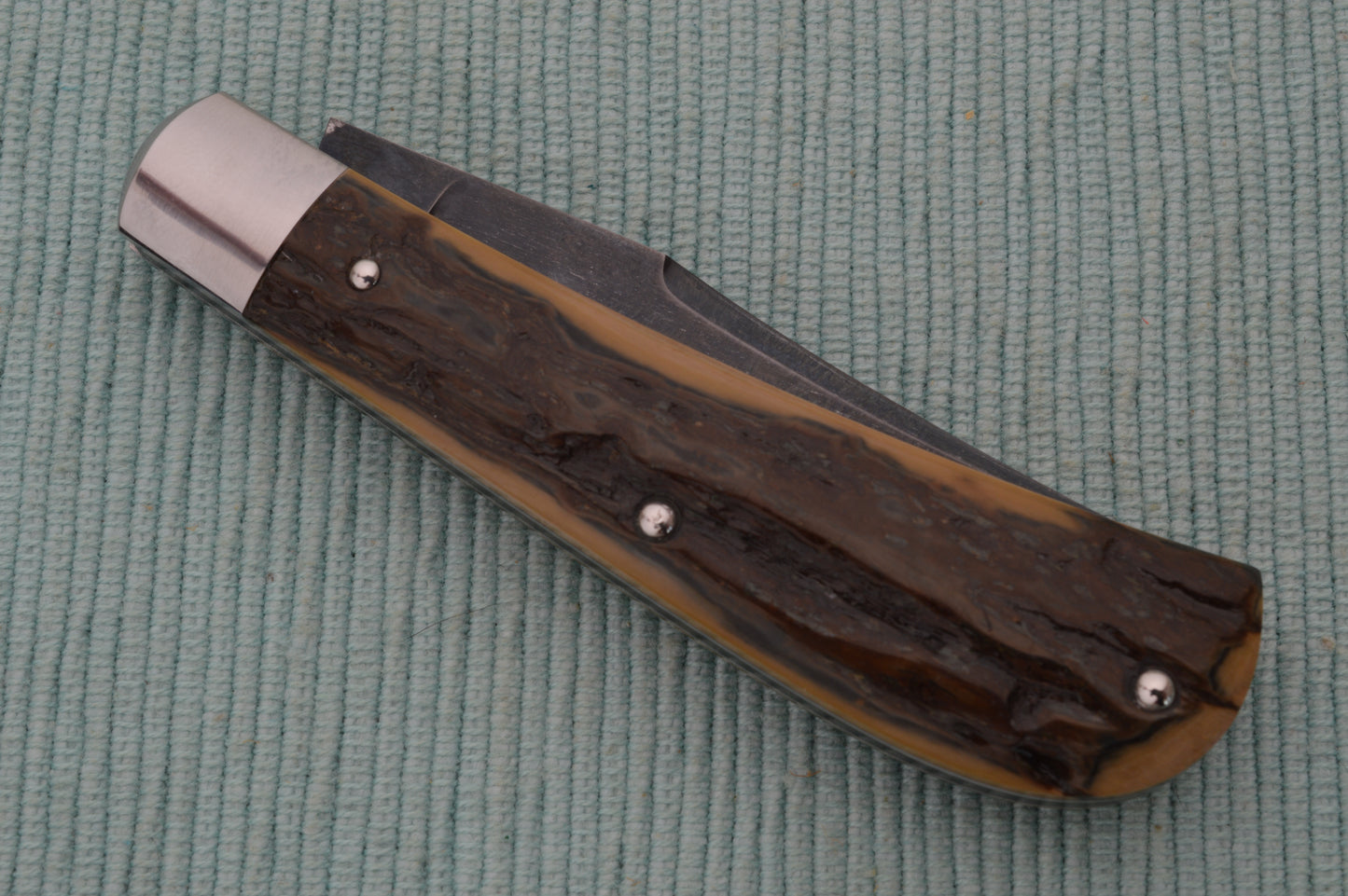 Daniel Keown Blued A2 Trapper, Ancient Fossil Material Slip-Joint Folding Knife (SOLD)