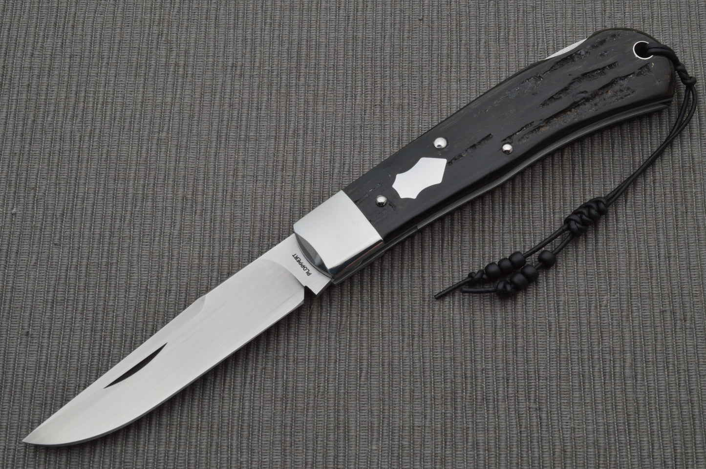Tom Ploppert Cape Buffalo Horn 80% F1 Pro, Lock-Back Folding Knife