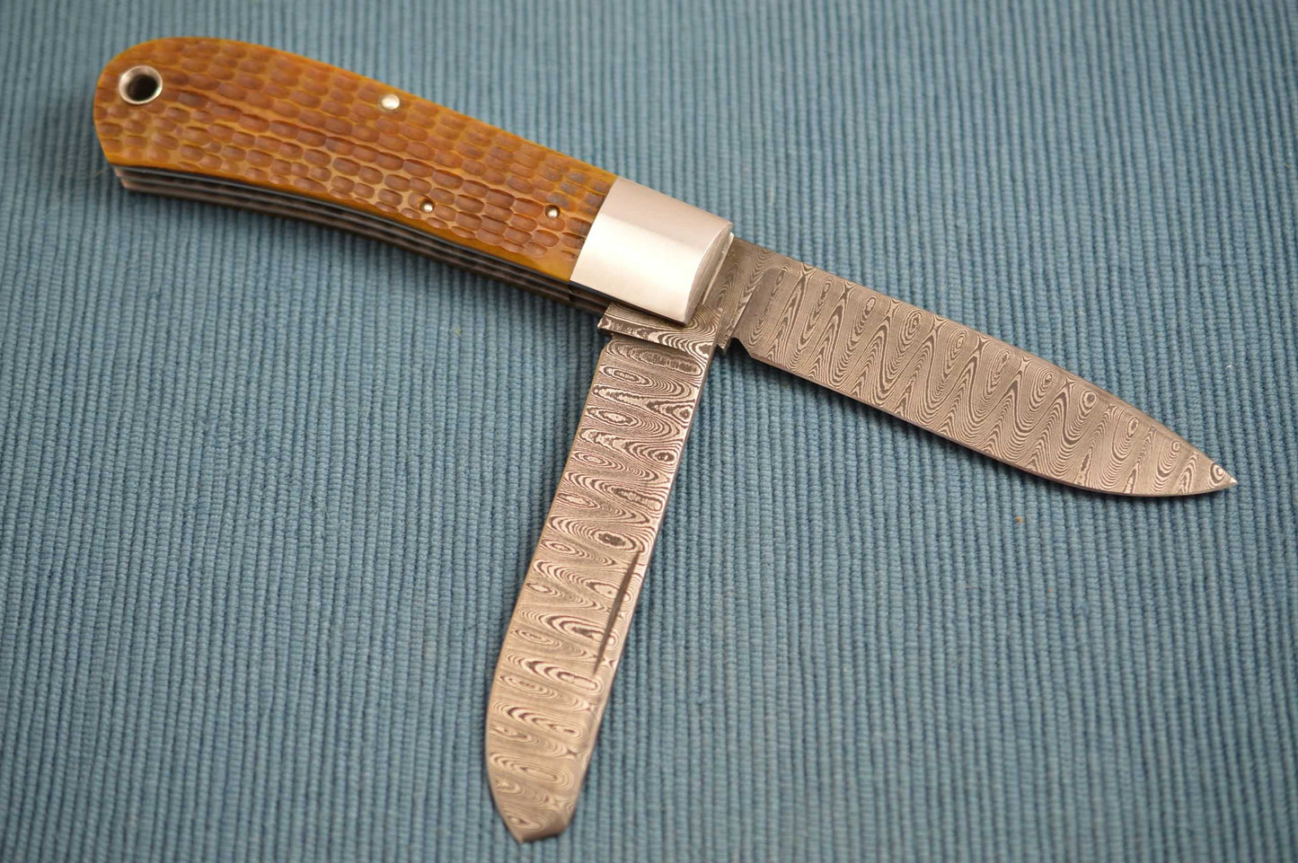 Luke Swenson Damascus 2-Blade Jigged Bone Dog's Head Trapper (SOLD)