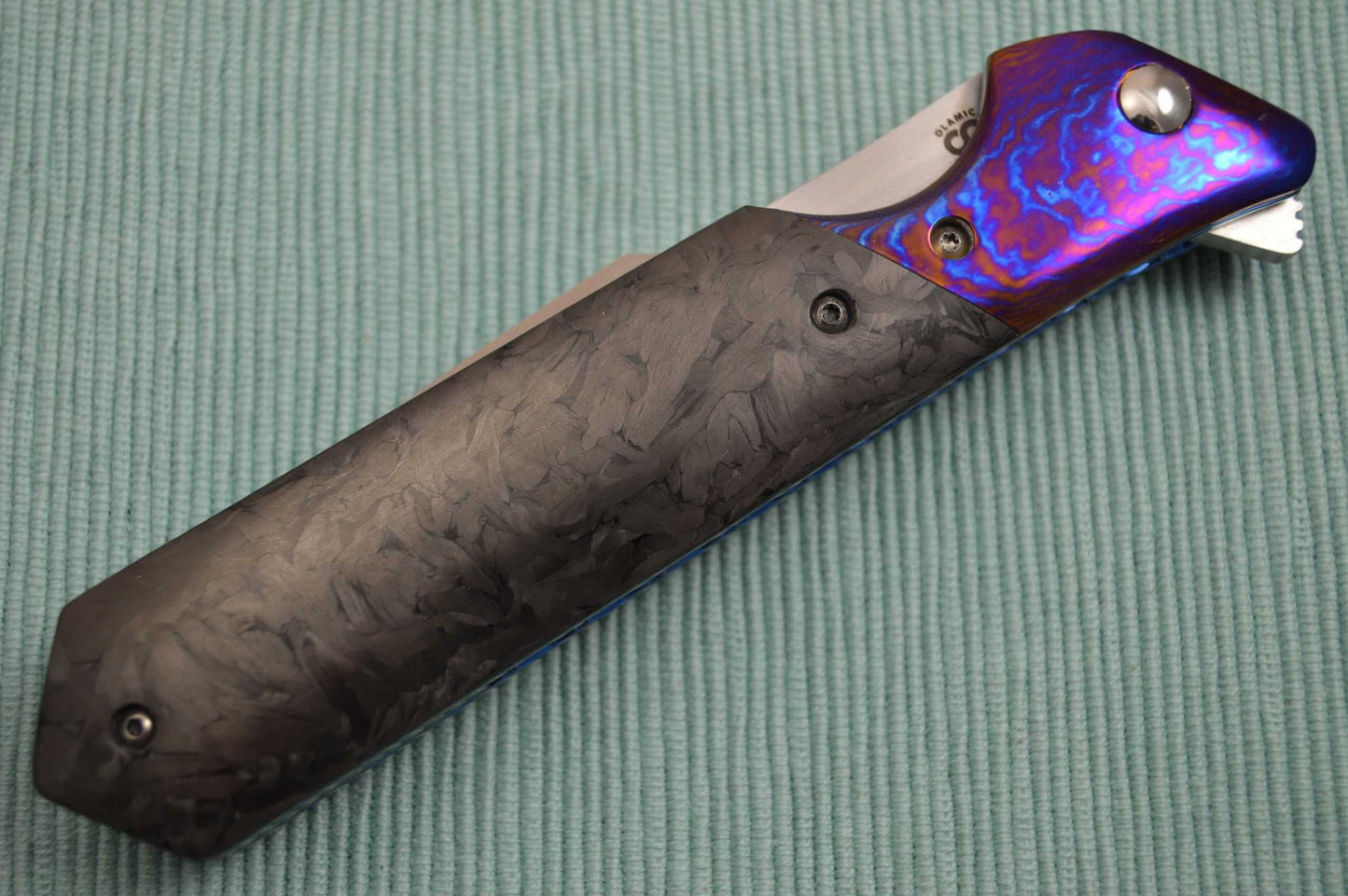 Olamic Cutlery Rainmaker, Marbled Carbon Fire Scales, Harpoon Blade, Ti-Damascus Bolster / Clip (SOLD)