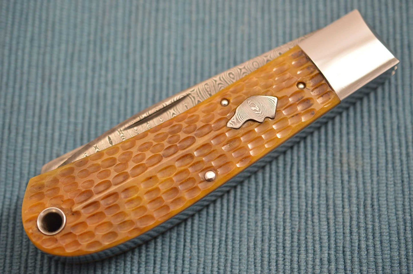 Luke Swenson Damascus 2-Blade Jigged Bone Dog's Head Trapper (SOLD)