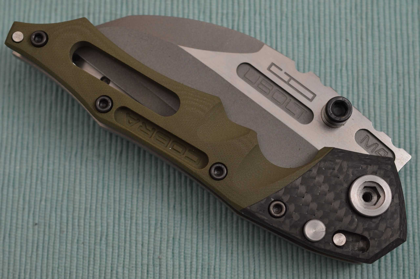 Dwaine Carrillo PROTOTYPE, No. 0, Button-Lock Cobra M4 Carbon Fiber, OD Green G10 (SOLD)