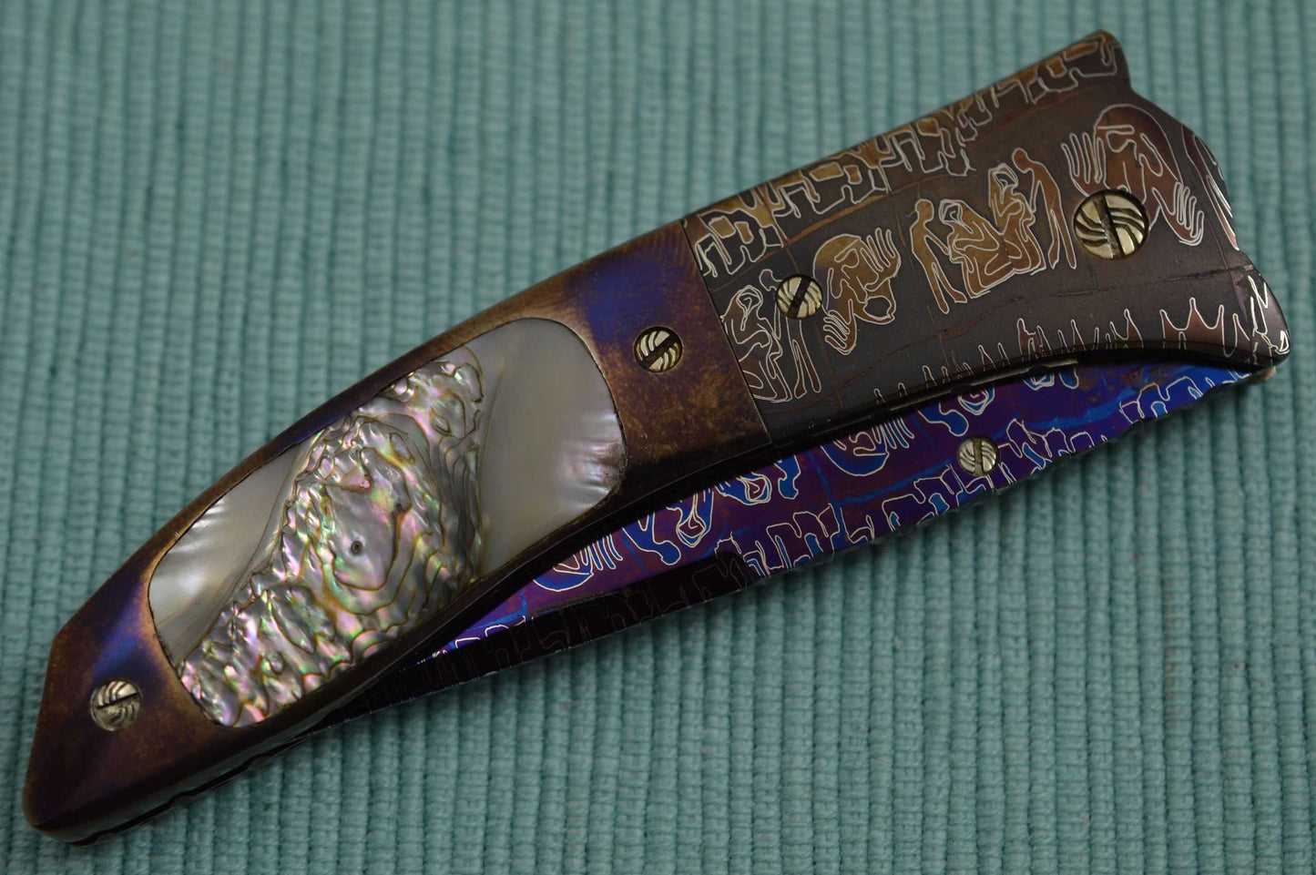 Joe Olson "Apocalypse" Interframe Folder, Damascus, Abalone, Ruby Thumbstud